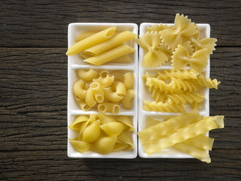 Close-up of colorful fusilli pasta in container on table