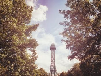 Low angle view of tower against cloudy sky