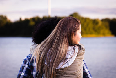 Side view of young woman looking away