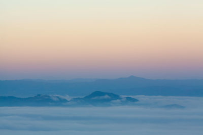 Scenic view of mountains against sky during sunset