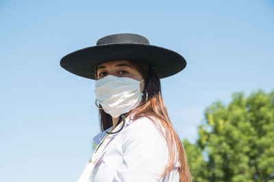 Portrait of young woman wearing face mask