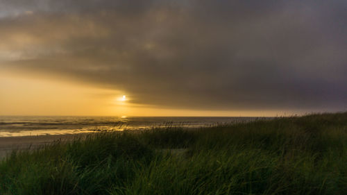 Scenic view of sea against sky during sunset