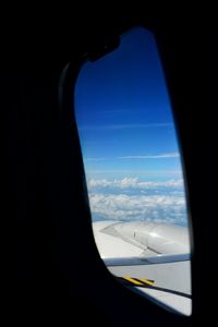 View of airplane seen through window