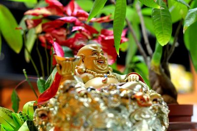 Close-up of laughing buddha figurine