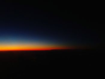 Scenic view of silhouette landscape against sky at sunset