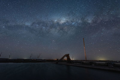 Scenic view of sea against sky at night