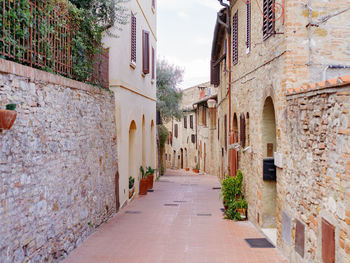 Narrow alley amidst buildings in town