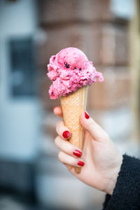 Hand holding ice cream cone