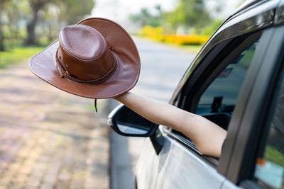 Rear view of woman driving car