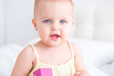 Portrait of cute baby girl at home