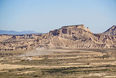 Scenic view of desert against clear sky