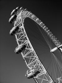 Low angle view of ferris wheel against sky