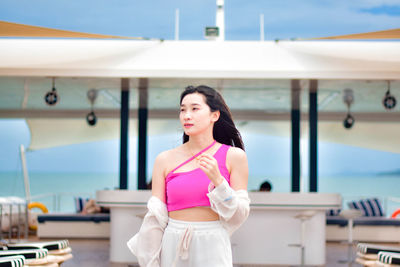 Young woman standing in gym