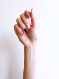 Close-up of hands against white background