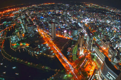 High angle view of illuminated buildings in city at night