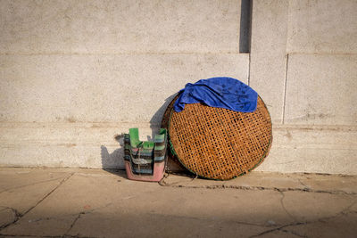 High angle view of hat in basket on footpath