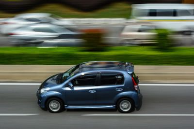 Blurred motion of car on road