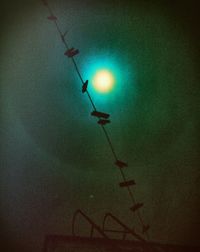 Low angle view of street light against sky