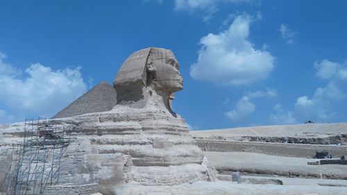 Sphinx statue against blue sky