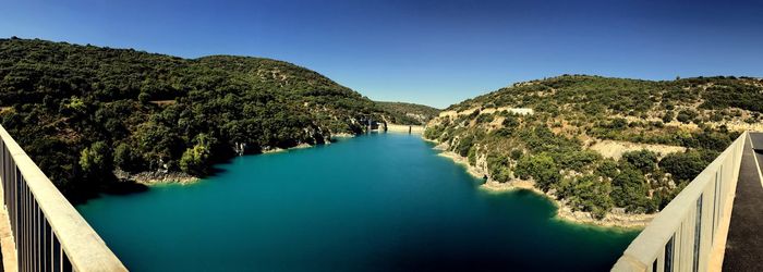 High angle view of river amidst trees against clear sky