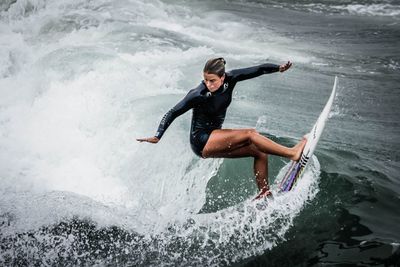 Woman jumping in sea