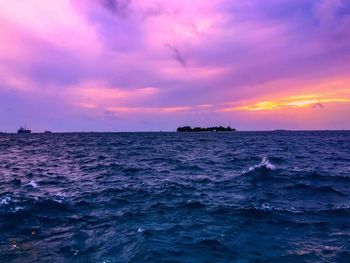 Scenic view of sea against cloudy sky