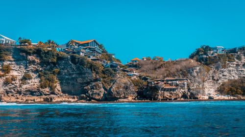 Scenic view of sea against clear blue sky