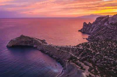 Novyi svit, crimea, sudak. aerial view of cape kapchik during beautiful sunset. black sea