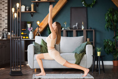 Woman sitting on chair in room