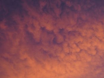 Low angle view of orange cloudy sky