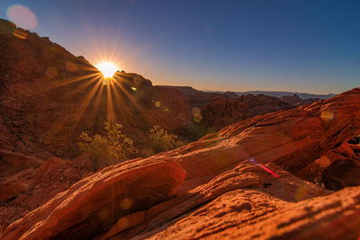 Scenic view of mountains against sky during sunset