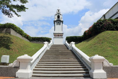 Staircase by building against sky