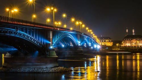 Illuminated bridge at night