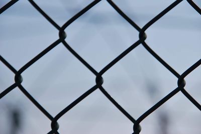 Full frame shot of chainlink fence against clear sky