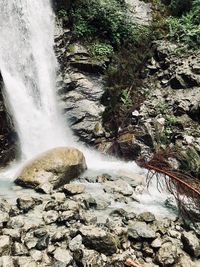 Idyllic shot of waterfall in forest