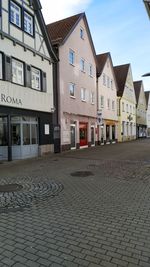 Houses by street in city