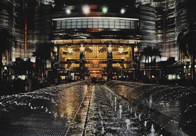 Illuminated building in city at night