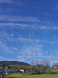 Scenic view of landscape against cloudy sky