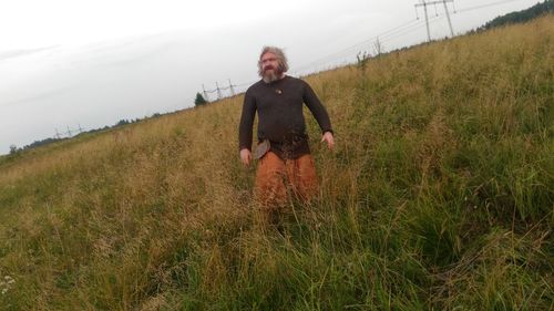 Portrait of man standing on field