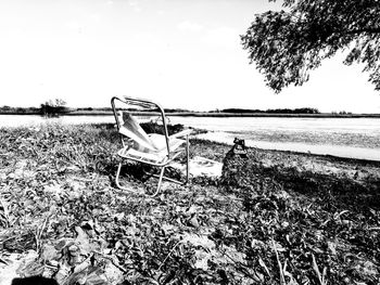 Abandoned boats on beach against sky