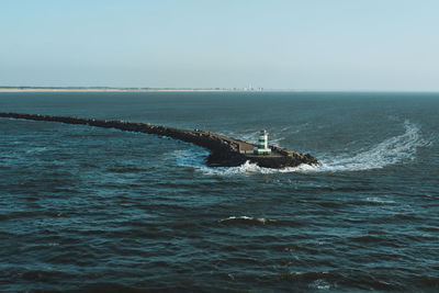 Scenic view of sea against clear sky