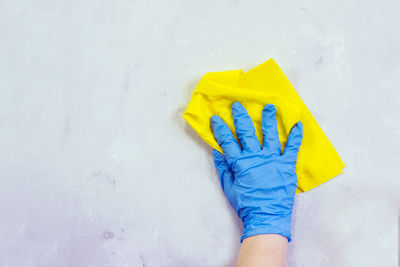 Low section of person with yellow umbrella