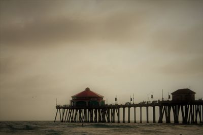 Pier over sea against sky