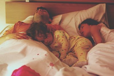 High angle view of sleeping on bed at home
