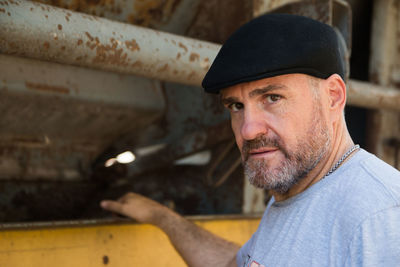 Close up portrait of adult man wearing hat