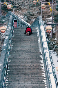 High angle view of people walking on railroad station