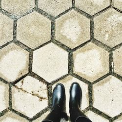 Low section of person standing on street