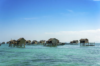 Panoramic view of sea and houses against sky