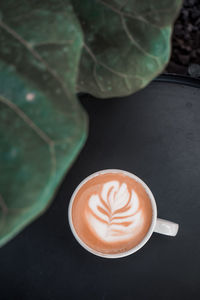 High angle view of cappuccino on table