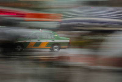 Blurred motion of car on road in city